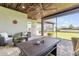 Relaxing covered patio with outdoor furniture, ceiling fan, and view of lake at 3203 Monaco Blvd, New Smyrna Beach, FL 32168