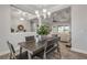 Dining area with a farmhouse table and view into the living room at 3203 Monaco Blvd, New Smyrna Beach, FL 32168