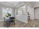 Open dining room with gray walls and wood-look tile floors at 3203 Monaco Blvd, New Smyrna Beach, FL 32168