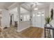 Bright entryway with tile flooring, a jute rug, and views into the dining area at 3203 Monaco Blvd, New Smyrna Beach, FL 32168