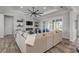 Living room featuring a sectional sofa, fireplace, and large windows at 3203 Monaco Blvd, New Smyrna Beach, FL 32168