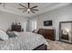 Main bedroom with large bed, dresser, and a wall-mounted TV at 3203 Monaco Blvd, New Smyrna Beach, FL 32168