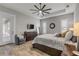 Main bedroom with large bed, dresser, and sliding glass doors leading outside at 3203 Monaco Blvd, New Smyrna Beach, FL 32168