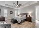 Spacious main bedroom with wood flooring, a ceiling fan, and plenty of natural light at 3203 Monaco Blvd, New Smyrna Beach, FL 32168