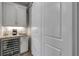 Well-organized pantry with ample shelving and wine cooler at 3203 Monaco Blvd, New Smyrna Beach, FL 32168