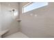 Large walk-in shower with gray tile and built-in seat at 3203 Monaco Blvd, New Smyrna Beach, FL 32168