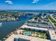 Aerial view showcasing community, pool, and waterfront location at 325 Causeway # E 203, New Smyrna Beach, FL 32169