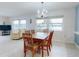 Bright dining room with water views and chandelier at 325 Causeway # E 203, New Smyrna Beach, FL 32169