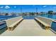 Private dock with benches overlooking the water at 325 Causeway # E 203, New Smyrna Beach, FL 32169