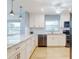 Updated kitchen featuring white shaker cabinets and granite countertops at 325 Causeway # E 203, New Smyrna Beach, FL 32169