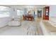 Spacious living room with ample natural light and view of dining area at 325 Causeway # E 203, New Smyrna Beach, FL 32169