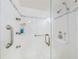 Walk-in shower with glass enclosure and grab bars at 325 Causeway # E 203, New Smyrna Beach, FL 32169