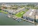 Aerial view of waterfront community with boat slips and pool at 335 N Causeway # H050, New Smyrna Beach, FL 32169