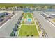 Aerial view showing condo community near the water with pool and shuffleboard at 335 N Causeway # H050, New Smyrna Beach, FL 32169