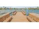 Community dock with benches overlooking the water at 335 N Causeway # H050, New Smyrna Beach, FL 32169