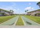 Well-maintained shuffleboard courts in a condo community setting at 335 N Causeway # H050, New Smyrna Beach, FL 32169