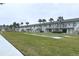 Lawn area with shuffleboard courts at 335 N Causeway # H23, New Smyrna Beach, FL 32169