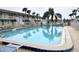 Clean community pool with lounge chairs at 335 N Causeway # H23, New Smyrna Beach, FL 32169