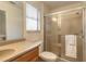 Updated bathroom with a walk-in shower, toilet, and vanity with wood cabinets at 3441 Gaveson Ct, Port Orange, FL 32129