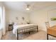 Cozy bedroom with a queen bed, built-in desk area, and natural light at 3441 Gaveson Ct, Port Orange, FL 32129