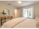 Serene bedroom with a queen bed, private access to bathroom and a vanity area at 3441 Gaveson Ct, Port Orange, FL 32129