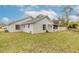 House exterior view showcasing backyard and landscaping at 3441 Gaveson Ct, Port Orange, FL 32129