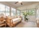 Relaxing sunroom features daybed and lush potted plants at 3441 Gaveson Ct, Port Orange, FL 32129