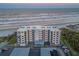 Aerial view of beachfront building and parking at 401 N Atlantic Ave # 504, New Smyrna Beach, FL 32169