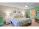 Bright bedroom with king-size bed and ensuite bathroom at 401 N Atlantic Ave # 504, New Smyrna Beach, FL 32169