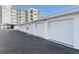 Row of private garages with automatic doors at 401 N Atlantic Ave # 504, New Smyrna Beach, FL 32169