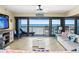 Spacious living room with ocean view and balcony at 401 N Atlantic Ave # 504, New Smyrna Beach, FL 32169