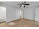 Bright bedroom with tile floors and access to bathroom at 405 / 407 S Cooper St # 1 / 2, New Smyrna Beach, FL 32169