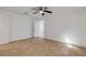 Well-lit bedroom with tile flooring and ceiling fan at 405 / 407 S Cooper St # 1 / 2, New Smyrna Beach, FL 32169