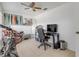 Bright home office with desk, chair, and surfboard at 405 / 407 S Cooper St # 1 / 2, New Smyrna Beach, FL 32169