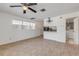 Living room features tile floors and a view into the kitchen and laundry area at 405 / 407 S Cooper St # 1 / 2, New Smyrna Beach, FL 32169