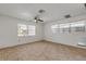 Bright living room featuring tile flooring and multiple windows at 405 / 407 S Cooper St # 1 / 2, New Smyrna Beach, FL 32169