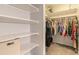 Large closet with hanging rods and shelving for storage at 413 Division Ave, Ormond Beach, FL 32174