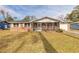 Brick ranch home with screened porch and spacious yard at 413 Division Ave, Ormond Beach, FL 32174