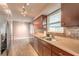 Kitchen with stainless steel appliances and wood cabinets at 413 Division Ave, Ormond Beach, FL 32174