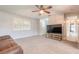 Living room with brown sofa and large TV at 413 Division Ave, Ormond Beach, FL 32174