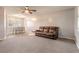 Living room with brown reclining sofa and dining area at 413 Division Ave, Ormond Beach, FL 32174