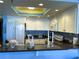 Well-equipped kitchen with white cabinets and blue tile at 4141 S Atlantic Ave # 602, New Smyrna Beach, FL 32169