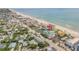 Aerial perspective highlighting a teal building's beachfront location at 423 S Atlantic Ave # 101, New Smyrna Beach, FL 32169