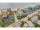 Aerial view showing a teal building's location near a beach and intersection at 423 S Atlantic Ave # 101, New Smyrna Beach, FL 32169