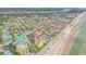 Aerial view of the community and its proximity to the beach at 423 S Atlantic Ave # 101, New Smyrna Beach, FL 32169