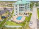 Building exterior with pool and parking at 423 S Atlantic Ave # 101, New Smyrna Beach, FL 32169