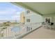 Spacious balcony with ocean and pool view, table and chairs at 423 S Atlantic Ave # 101, New Smyrna Beach, FL 32169