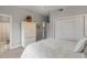 Bedroom with queen bed and built-in storage at 423 S Atlantic Ave # 101, New Smyrna Beach, FL 32169