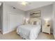 Bedroom with queen bed, closet, and coastal artwork at 423 S Atlantic Ave # 101, New Smyrna Beach, FL 32169