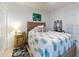 Guest bedroom with a full-size bed, unique decor, and plenty of natural light at 434 Bouchelle Dr # 202, New Smyrna Beach, FL 32169